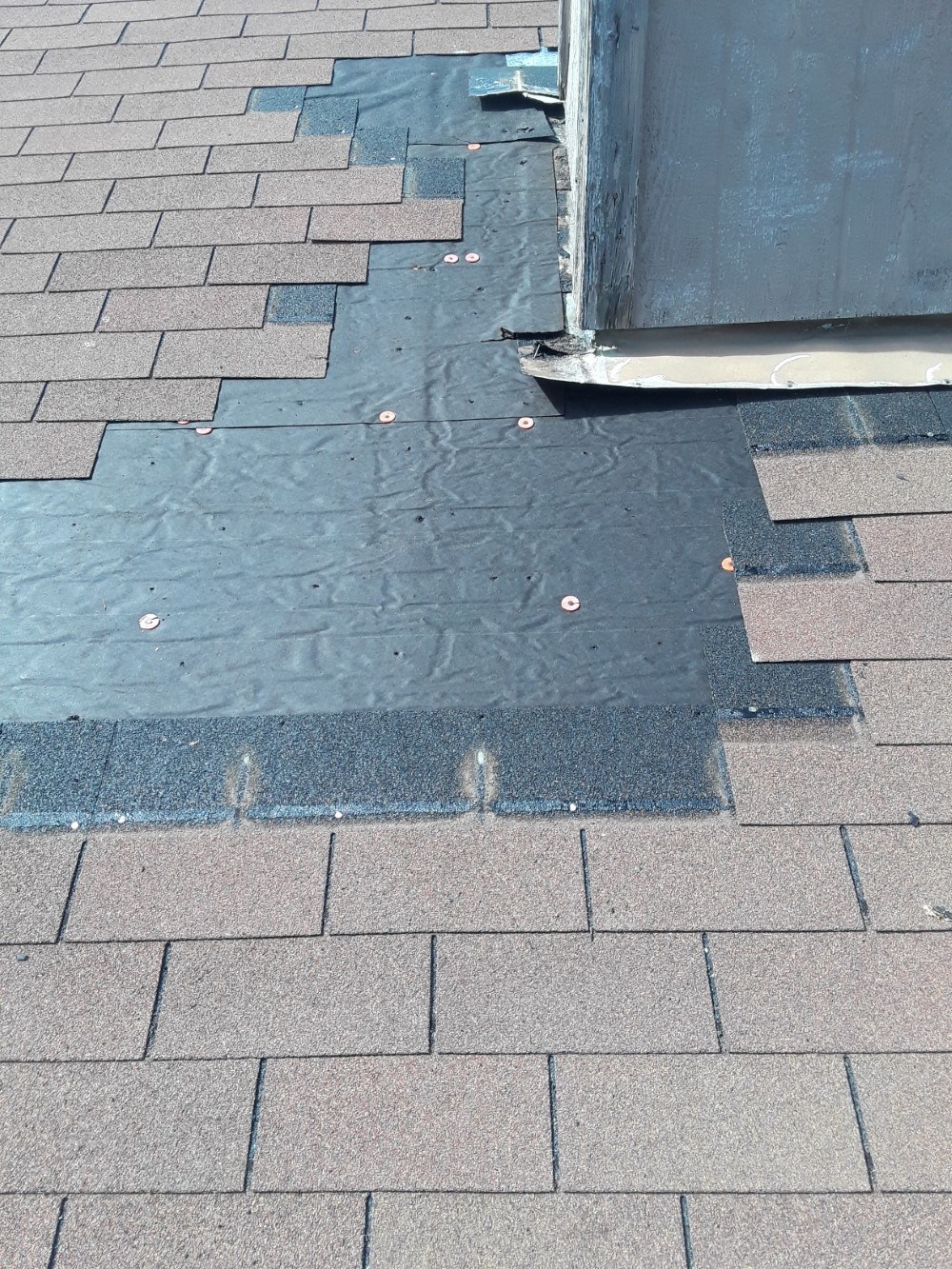Repair and replace damage shingles shingles removed and can see good underlayment